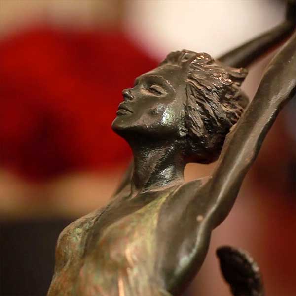 Detail of a brass sculpture of a ballet dancer from a film about interior design business, English Rose Interiors